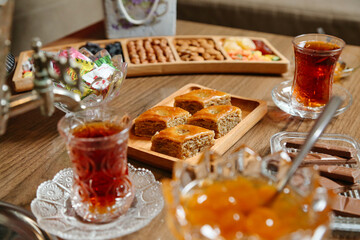 Wooden Table Adorned With Plates of Food and Drinks
