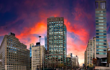 Selbstklebende Fototapeten Hochrot Fiery Sky in New York City Soho, a vibrant blazing cloudscape over Lower Manhattan, USA  © Naya Na