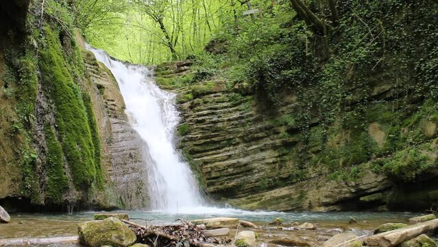 Waterfall flowing through the forest. A waterfall pouring out of rocks eroded by streams. Erfelek Waterfalls Video, Blacksea, Erfelek Sinop, Turkey