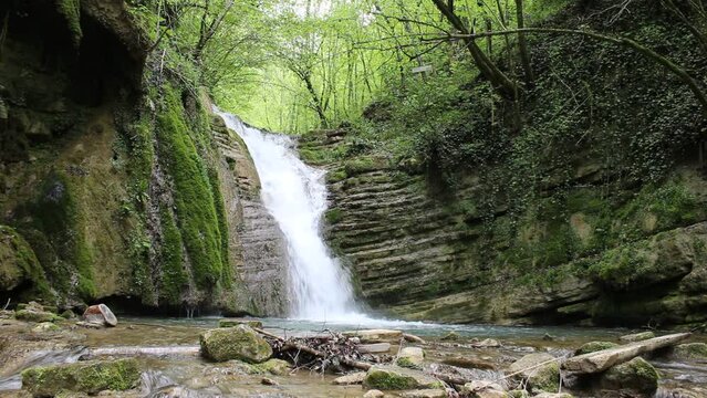 Waterfall flowing through the forest. A waterfall pouring out of rocks eroded by streams. Erfelek Waterfalls Video, Blacksea, Erfelek Sinop, Turkey