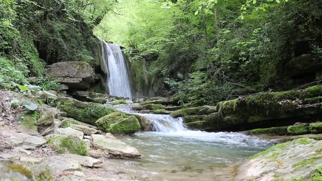 Waterfall flowing through the forest. A waterfall pouring out of rocks eroded by streams. Erfelek Waterfalls Video, Blacksea, Erfelek Sinop, Turkey