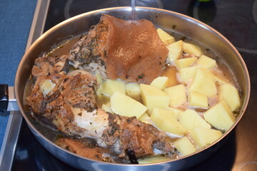 pork roast with potatoes in the pan