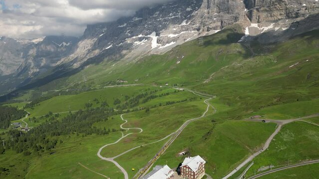 Aerial shot of the trail traveling in the Kleine Scheidegg mountain pass, Switzerland