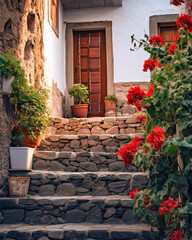 Fototapeta na wymiar Picturesque rural dwelling adorned with blooming flowers, stone steps, and wooden details.