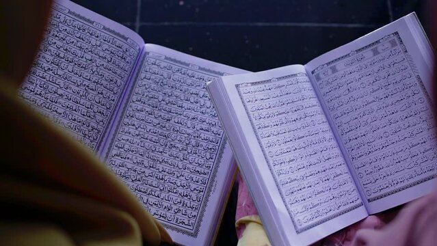Two moslem women reading the Koran