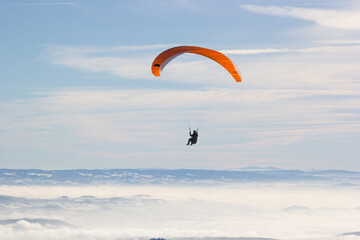 Paragliding. Paragliding in Auvergne. paragliding flight in the mountains in France. Paragliding...