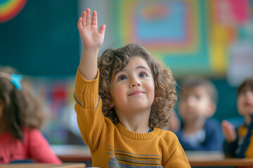 A 5-year-old child raising their hand to share an opinion in a classroom setting.