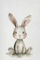 Obraz premium White rabbit sitting on the ground