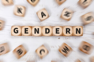 Gendern als Symbol für gendergerechte Sprache gender auf Würfeln Kommunikation Konzept