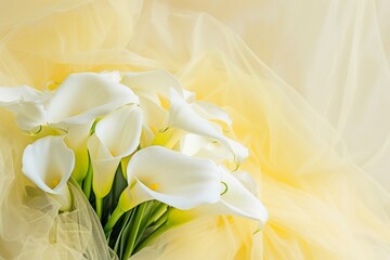Fototapeta na wymiar Bouquet of calla lilies on a yellow fabric background