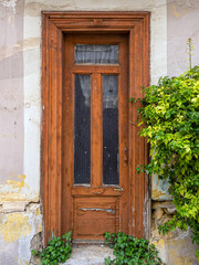 An old wooden door of an almost abandoned house, somewhere in the less chic suburbs of Athens. A different trip to Greece.