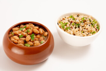 Bowls of rice and beans isolated in white background in front view