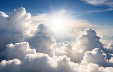 Naklejka na ściany i meble Sun over the beautiful white fluffy clouds