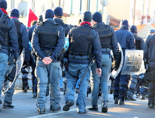 police in riot gear during the protest demonstration with helmets