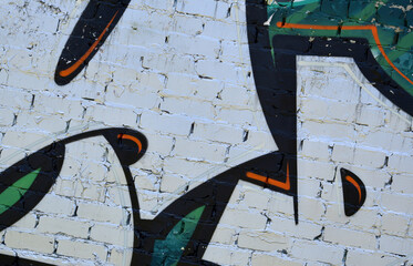Colorful background of graffiti painting artwork with bright aerosol outlines on wall. Old school street art piece made with aerosol spray paint cans. Contemporary youth culture backdrop
