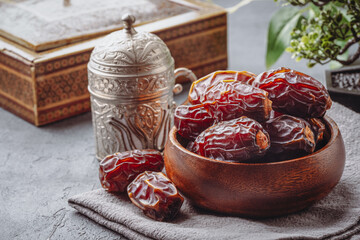 Dried delicious date fruit on vintage stone background