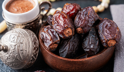 Dried delicious date fruit on vintage stone background