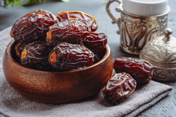 Dried delicious date fruit on vintage stone background