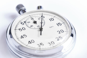 Mechanical stopwatch white background closeup.