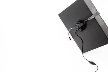 Call center operator desktop, customer service help with headphones headset and laptop