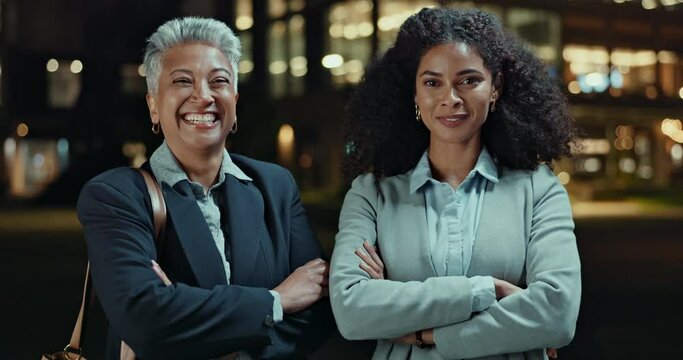 Business woman, night and city with professional for career opportunity, ambition or confidence. Portrait of employees or coworkers with smile and arms crossed for late evening in an urban town