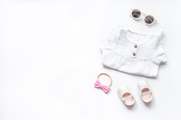 Fashion trendy look of baby girl with white dress and accessories