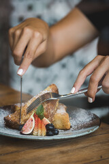 person eating French toast