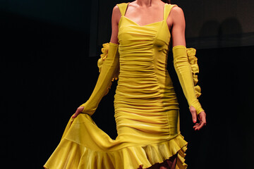 Yellow velvet dress with long hem. Female clothing elegant outfit. Front view