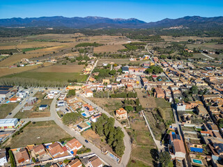 Dive into the rich tapestry of Spain's medieval past with panoramic aerial views of Garriguella...