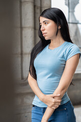 person with black hair wears casual clothes, natural beauty and fashion, lifestyle of latin woman posing glamorously, background