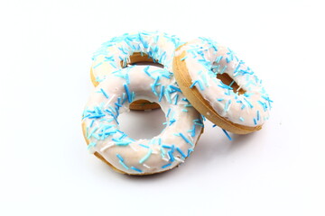 Sweet strawberry glazed donuts with sprinkles on white background, Delicious colorful donuts isolated on white background With clipping path.