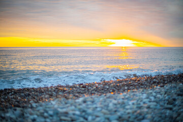 stone seashore at sunset