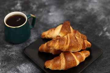 Freshly baked croissants, isolated on white background. 