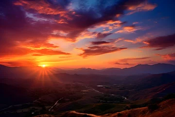 Fotobehang Epic Sunrise/Sunset Scene Displaying Radiant Sky Colors Over Low-Lying Hills. © Austin