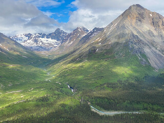 Lake Clark National Park in Alaska. Emerson Creek and Falls. Aerial view of spruce trees, rugged mountains near Twin Lakes.