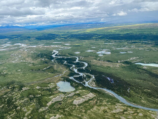 Lake Clark National Park in Alaska. Emerson Creek and Falls. Aerial view of spruce trees, rugged...
