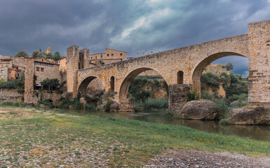 Fototapeta premium Romanesque bridge over River Fluvia - Besalu, Catalonia