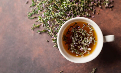 tea with thyme in a cup. Selective focus.