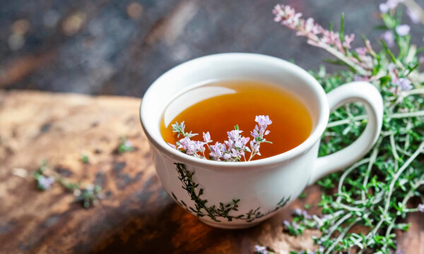tea with thyme in a cup. Selective focus.