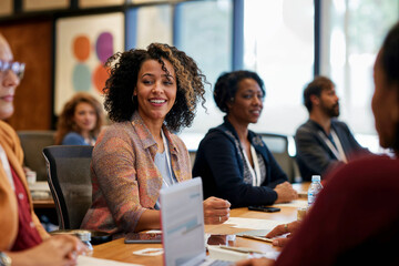 Candid capture of an engaged African American woman during a business training session, highlighting DEI in the workplace.

