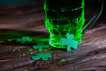 Celtic party. A lucky trilstnik with a glass of green beer in the bar for the holiday St. Patrick's...
