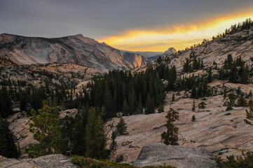 Sunset on Half Dome and the granite landscape around Olmsted Point, Yosemite National Park, California, USA.