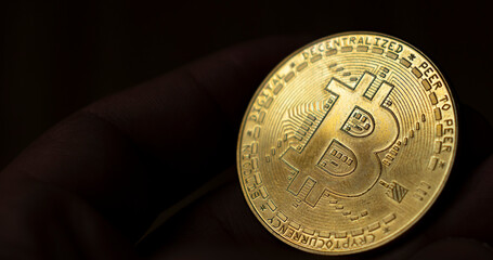 Crypto currency Bitcoin (BTC). Cryptocurrency - photo of golden bitcoin physical gold coin. - 748968433