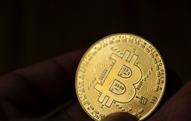 Crypto currency Bitcoin (BTC). Cryptocurrency - photo of golden bitcoin physical gold coin. - 748968434