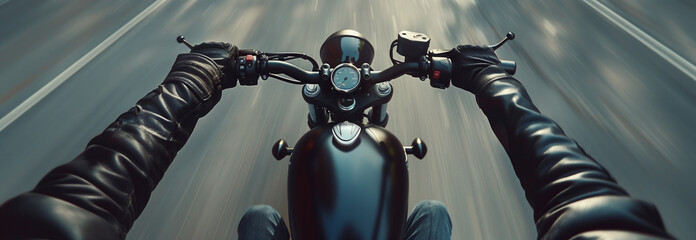 Closeup of two hands on motorcycle handlebars, motorcyclist on paved road. - obrazy, fototapety, plakaty