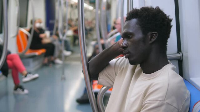 thoughtful african man traveling on the metro deep in thought