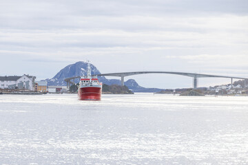 STOREGG is a Fishing Vessel and is sailing under the flag of Norway. Her length overall (LOA) is 27.99 meters and her width is 8 meters. Here passing Br&oslash;nn&oslash;ysund harbor