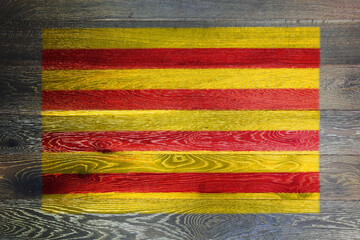 Catalonia flag on rustic old wood surface background