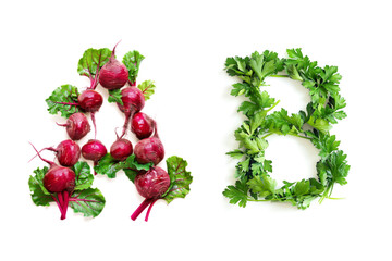 Vegetable Letters "A" and "B" Made of Beet Root and Parsley Isolated on White Background