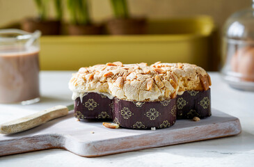 A traditional Italian Colomba Pasquale cake, beautifully topped with almonds and sugar, ready for...